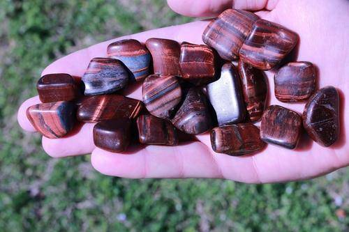 Red Tigers Eye Tumbled Stone-Cosmic Cuts