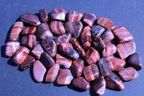 Red Tigers Eye Tumbled Stone-Cosmic Cuts